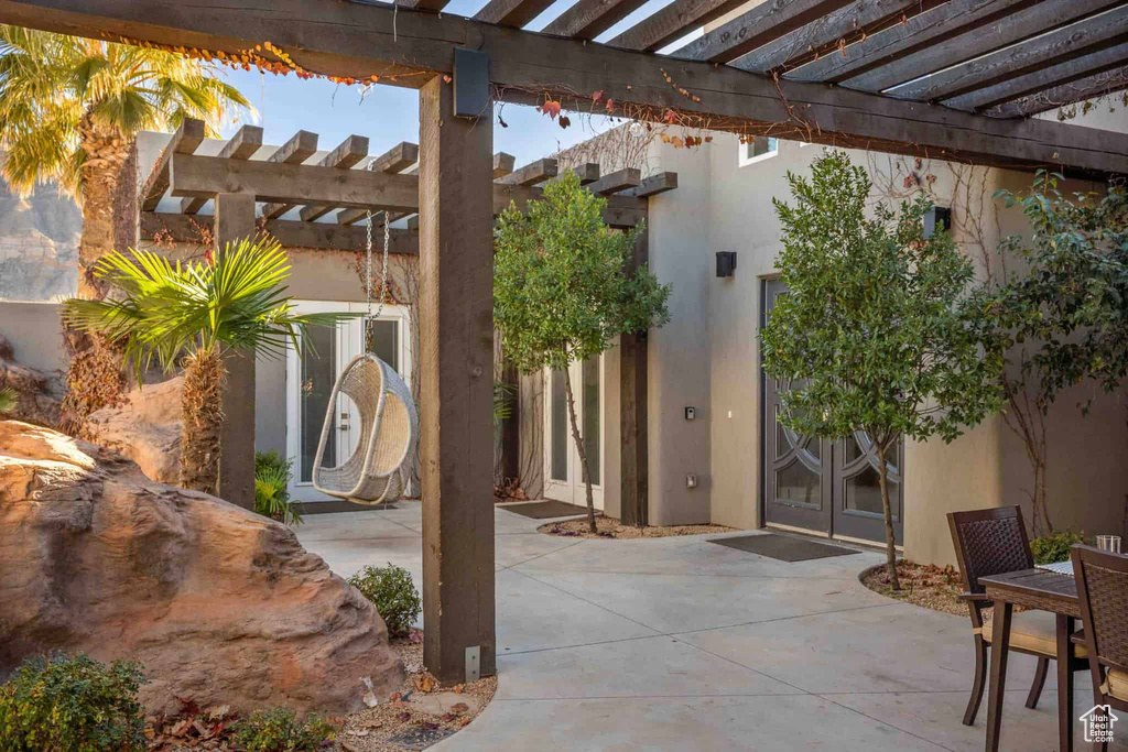 View of patio / terrace featuring french doors and a pergola