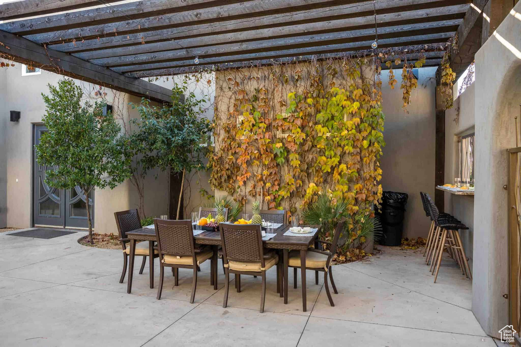 View of patio / terrace featuring outdoor dining area and a pergola
