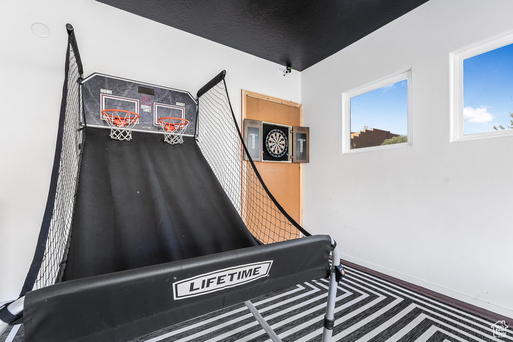 Detailed view of carpet floors and baseboards