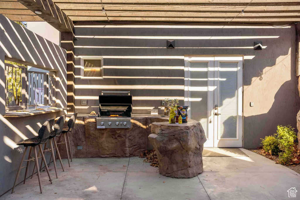 View of patio featuring area for grilling