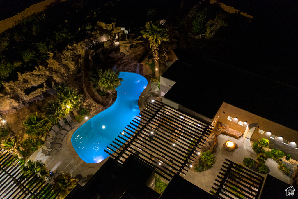 Aerial view at night of view of pool