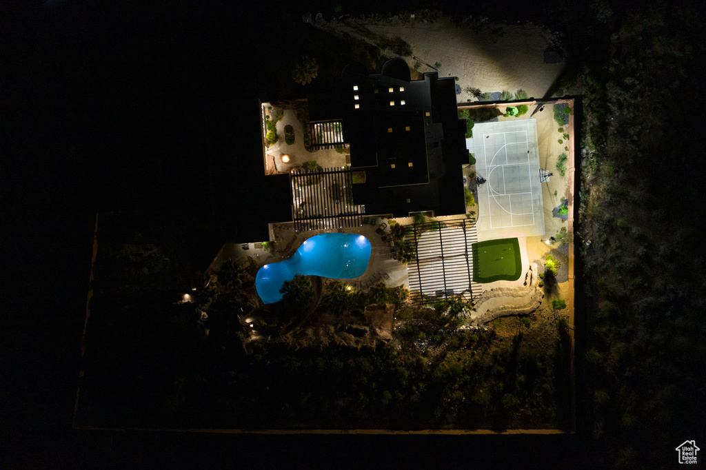 Aerial view at night of view of pool and property boundaries highlighted