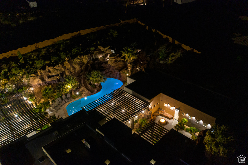 Aerial view at twilight of view of pool area