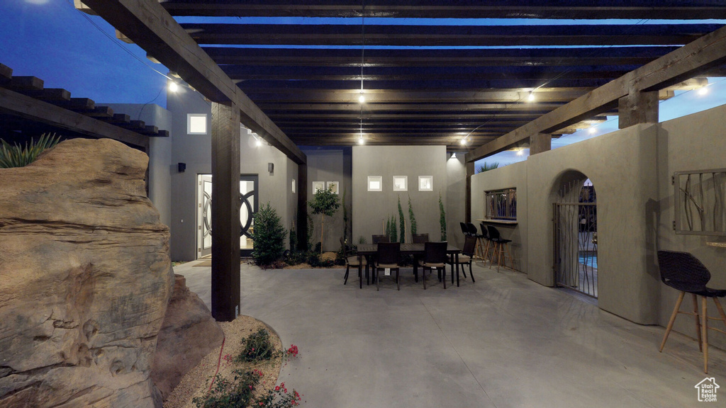 View of patio featuring outdoor dining area and a pergola