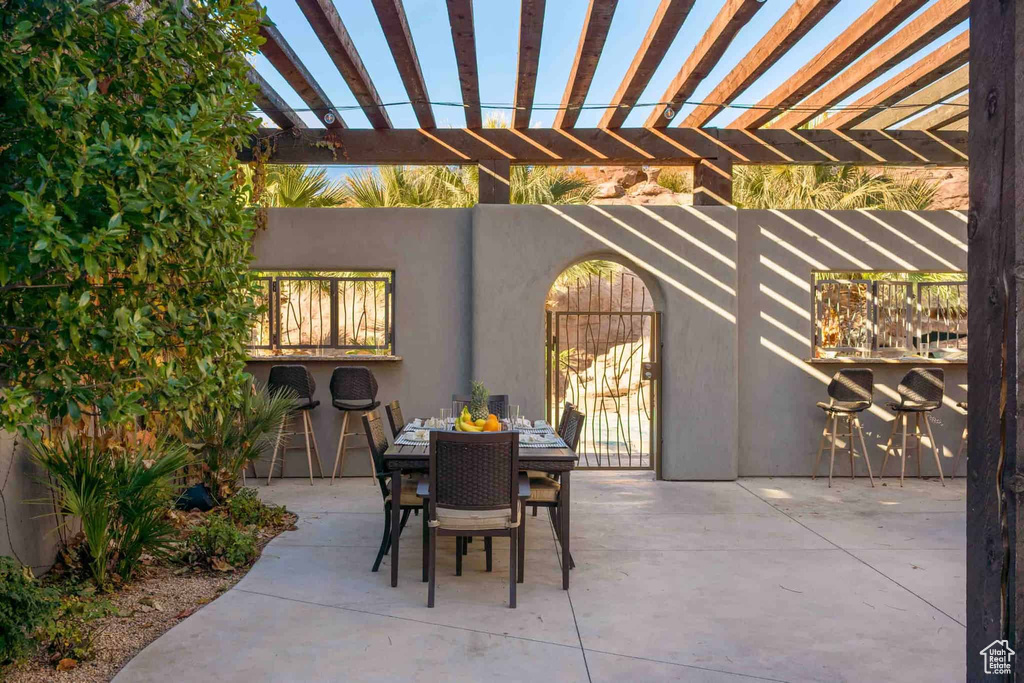 View of patio / terrace with outdoor dining area and a pergola