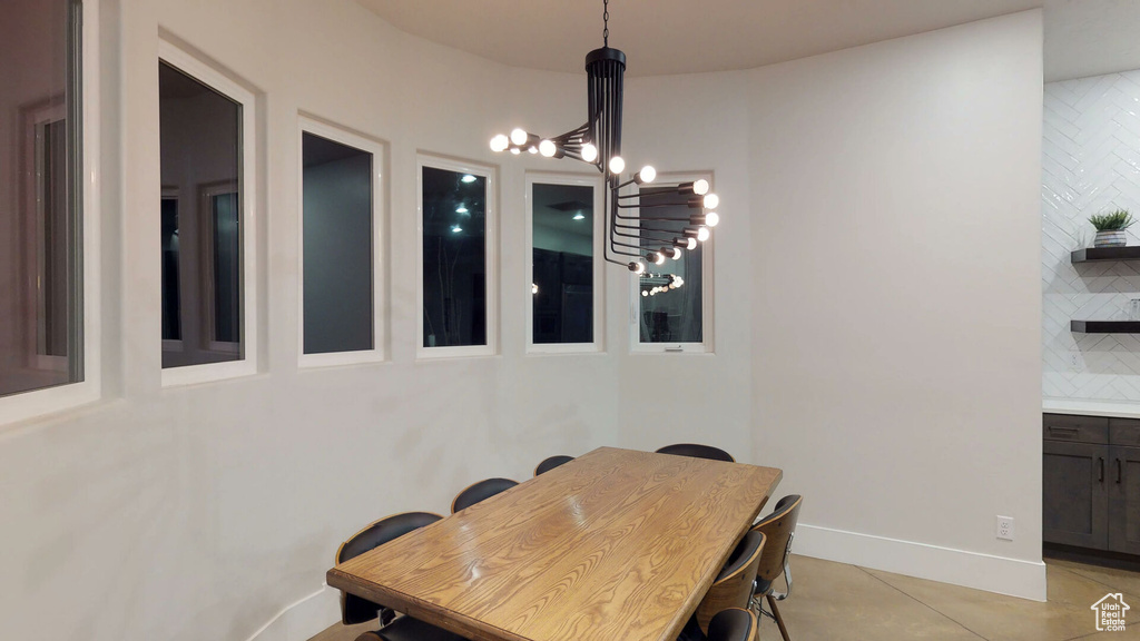 Dining space featuring a chandelier and light tile patterned floors