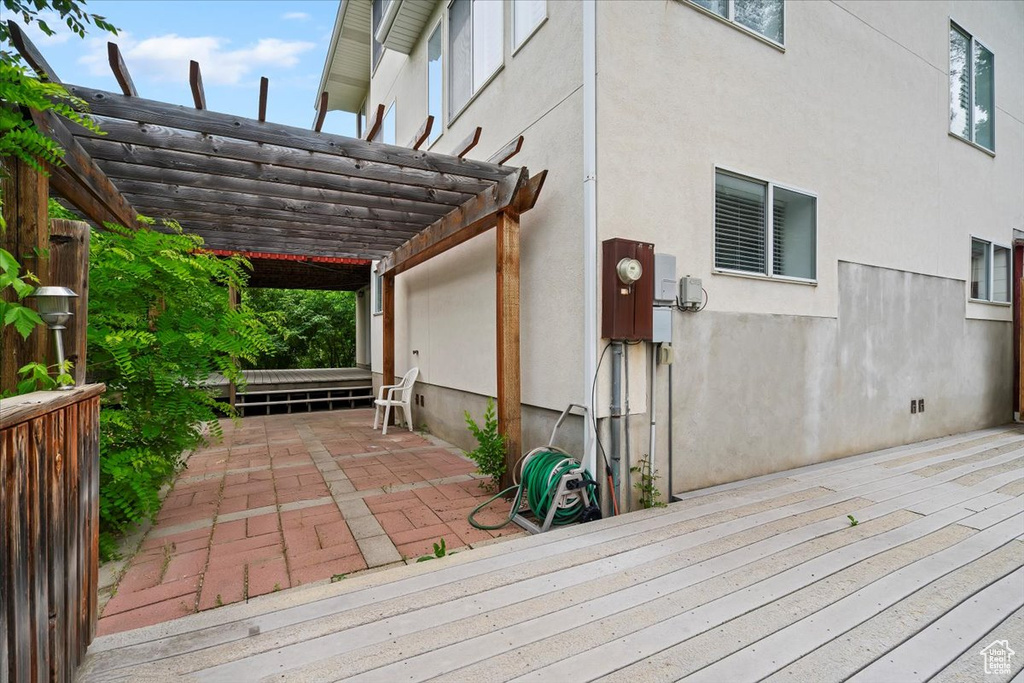 Deck featuring a pergola and a patio area