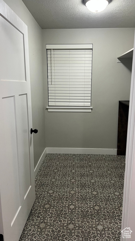 Walk in closet featuring tile patterned floors