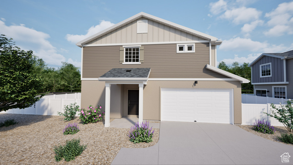 View of front of house featuring concrete driveway, board and batten siding, and a garage