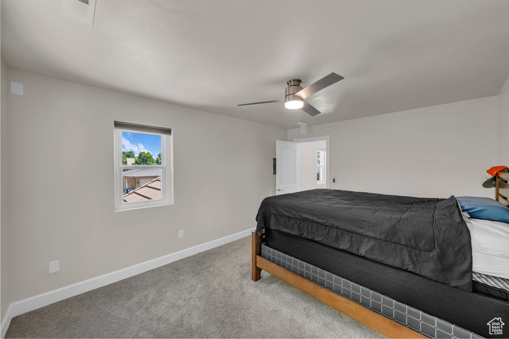 Bedroom featuring carpet and ceiling fan