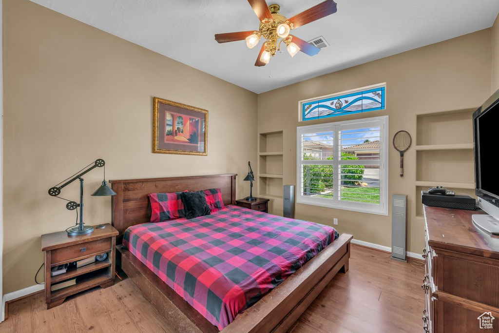 Bedroom featuring light wood-style flooring and a ceiling fan
