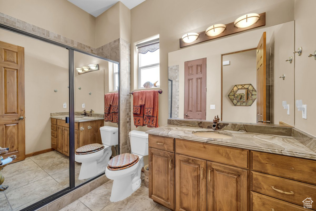 Full bath featuring vanity and toilet