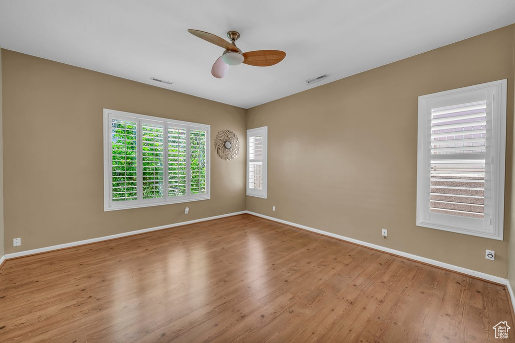 Spare room featuring ceiling fan and wood finished floors