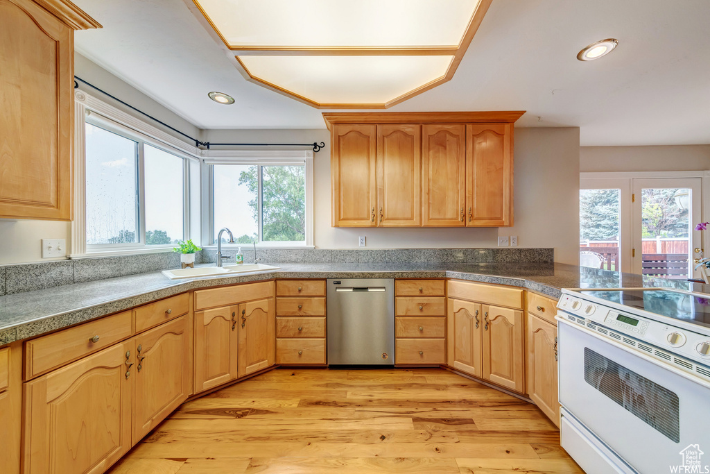 Kitchen featuring dishwasher, white range with electric cooktop, light wood-type flooring, tile countertops, and recessed lighting
