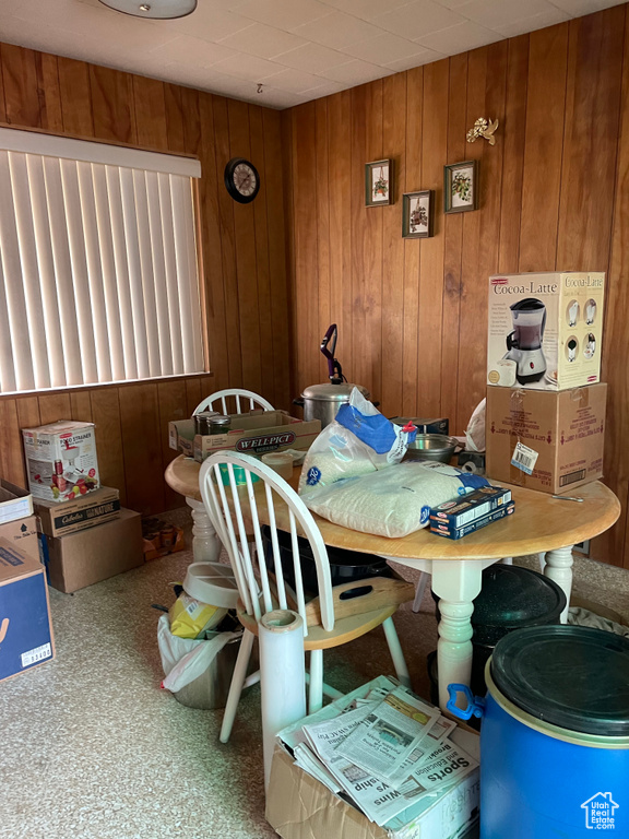 Dining room with wood walls