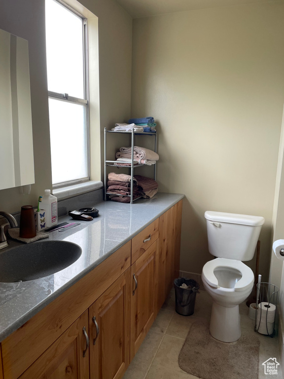 Bathroom with vanity and tile patterned floors