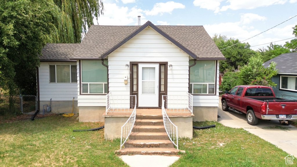 Bungalow-style house featuring a shingled roof