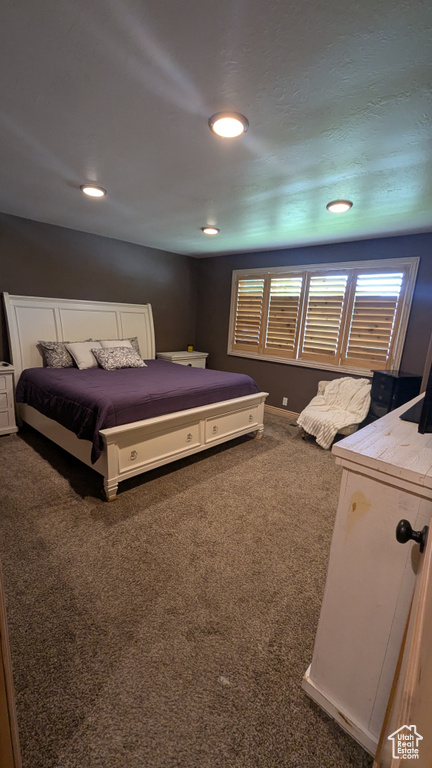 Bedroom featuring carpet flooring, multiple windows, and recessed lighting