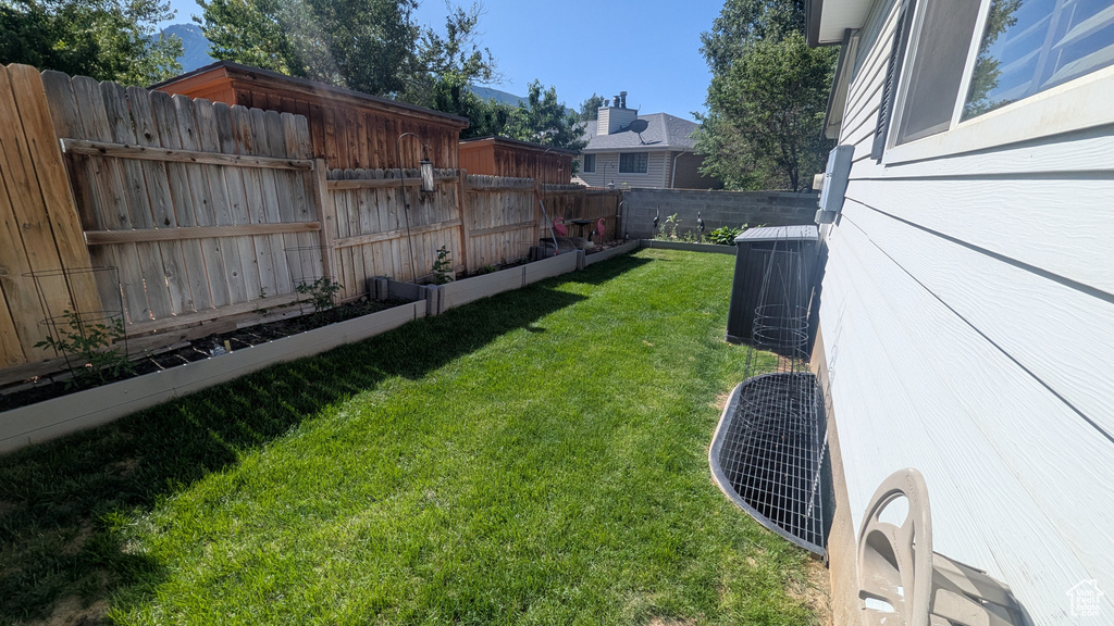 View of fenced backyard