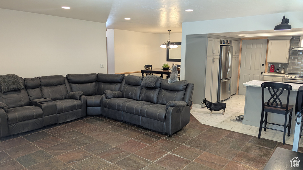 Living area with a chandelier and recessed lighting