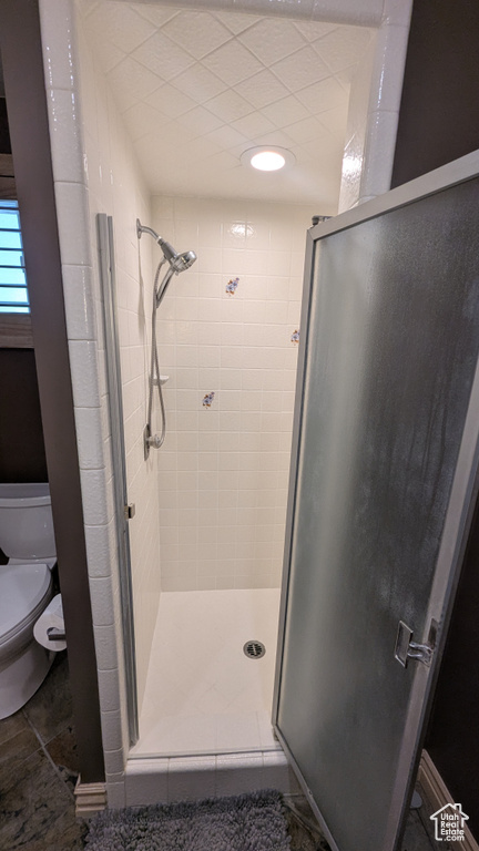 Bathroom featuring a stall shower and tile patterned flooring