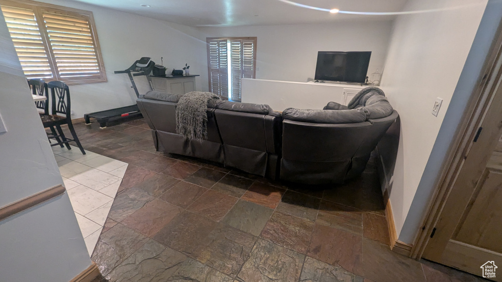 Living area with stone tile flooring