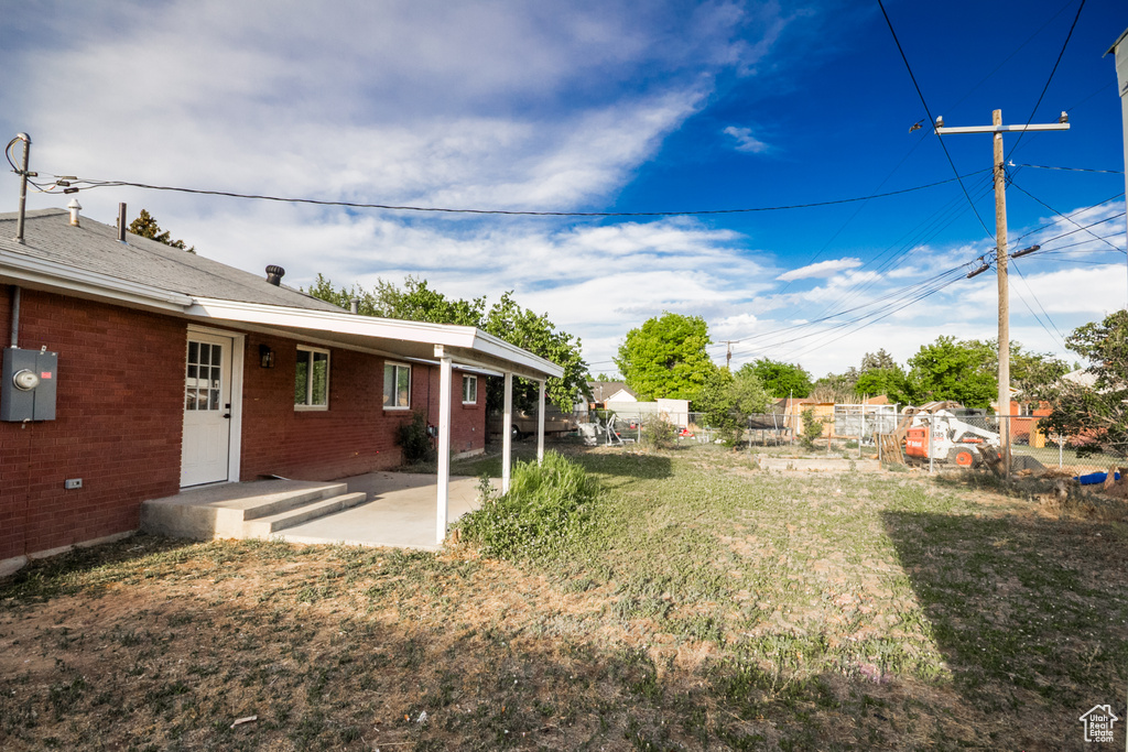 View of yard with a patio