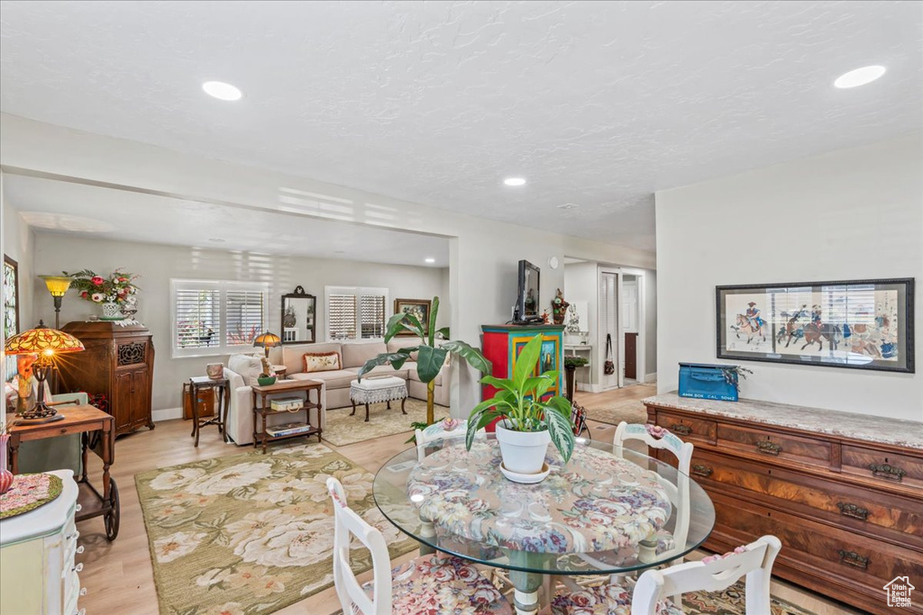Dining room featuring light wood-style flooring and recessed lighting