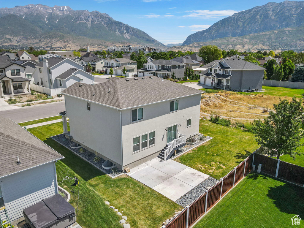 Aerial view of residential area featuring a mountain backdrop