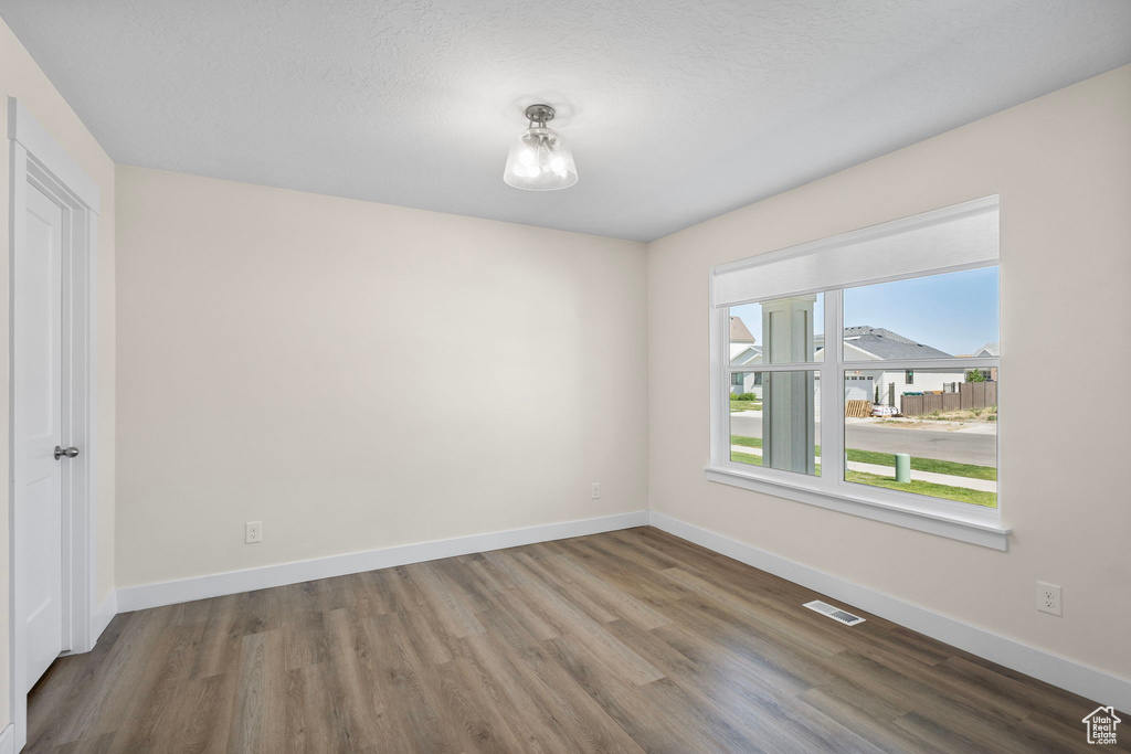 Empty room with wood finished floors