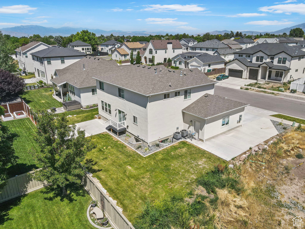 Aerial view of residential area with mountains