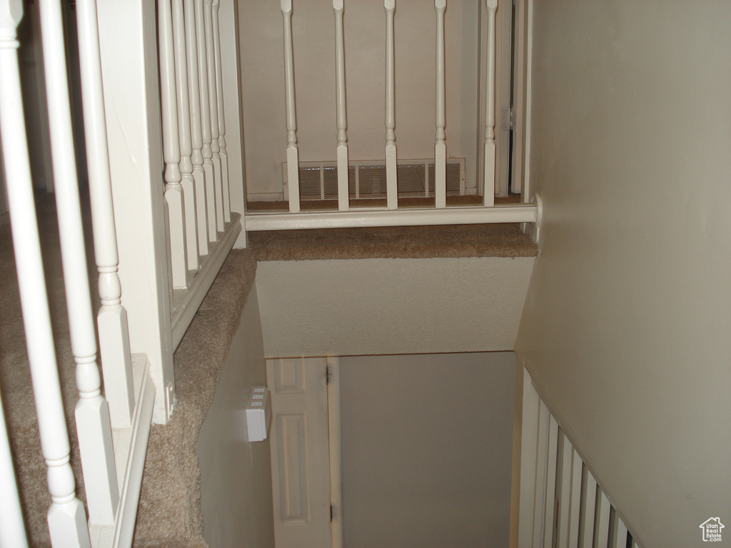 Hallway featuring carpet
