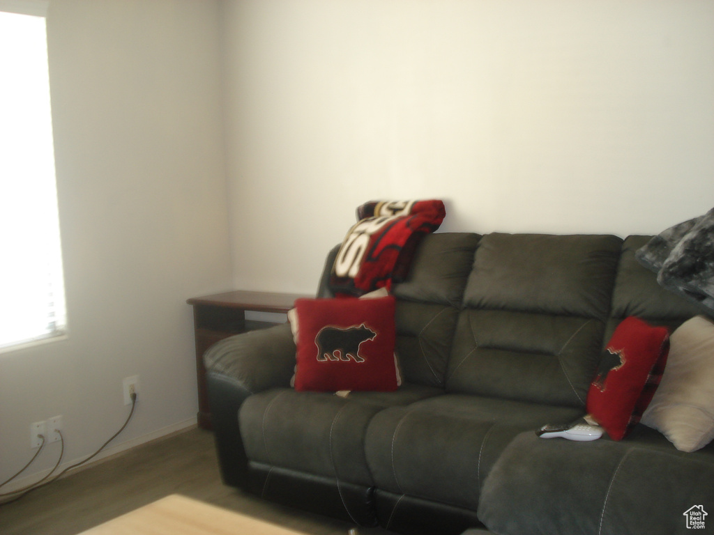 Living room with wood finished floors and baseboards