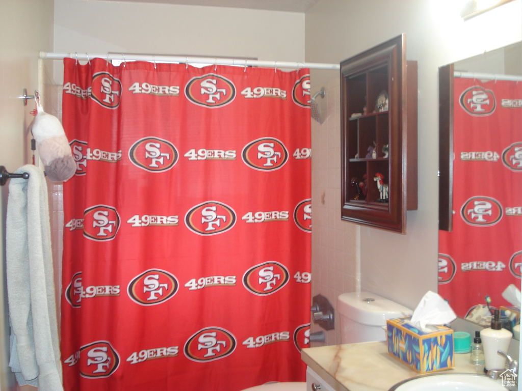Full bath featuring vanity and a shower with shower curtain