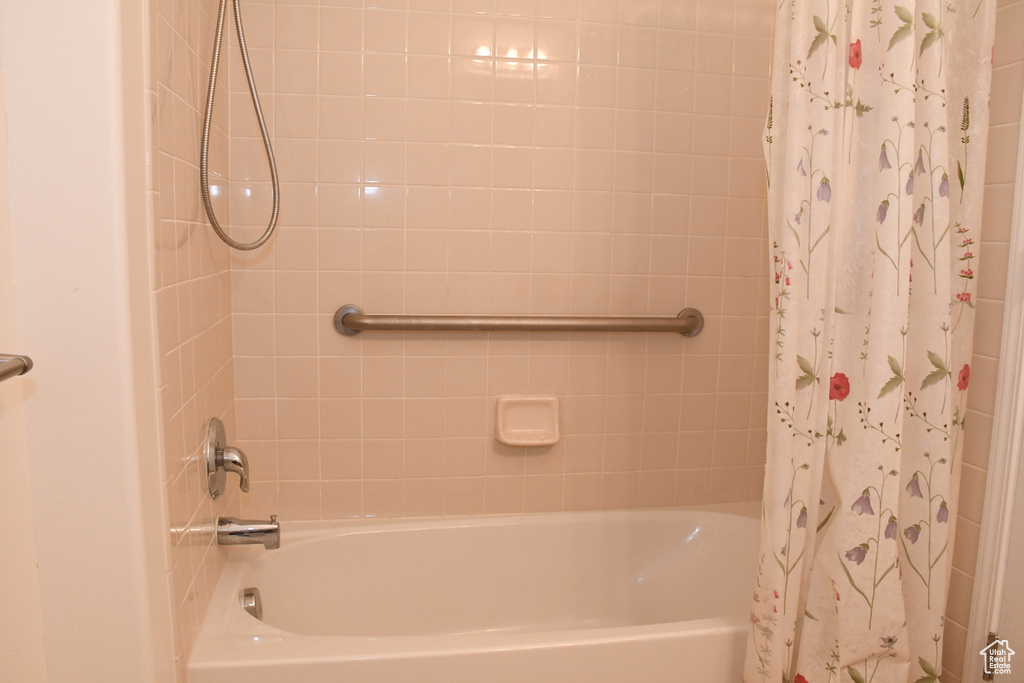 Full bath featuring shower / bath combination with curtain