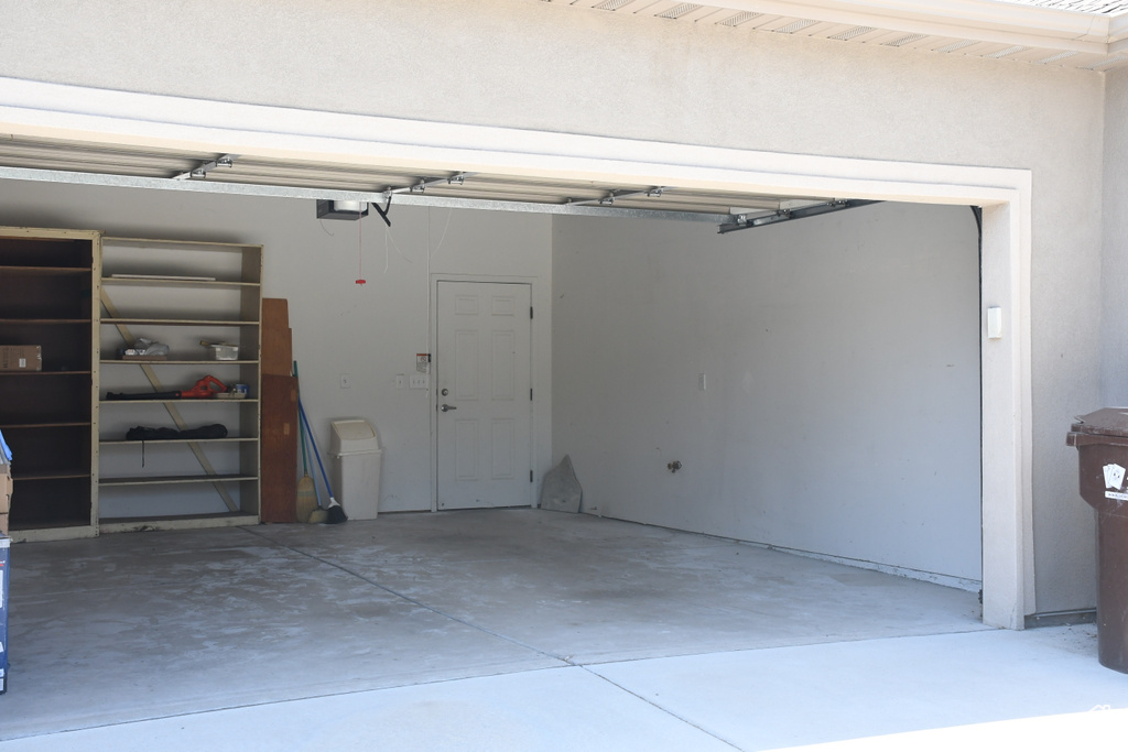 Garage featuring a garage door opener