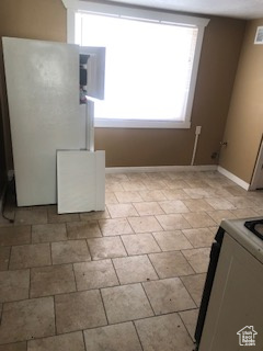 Kitchen with baseboards and range