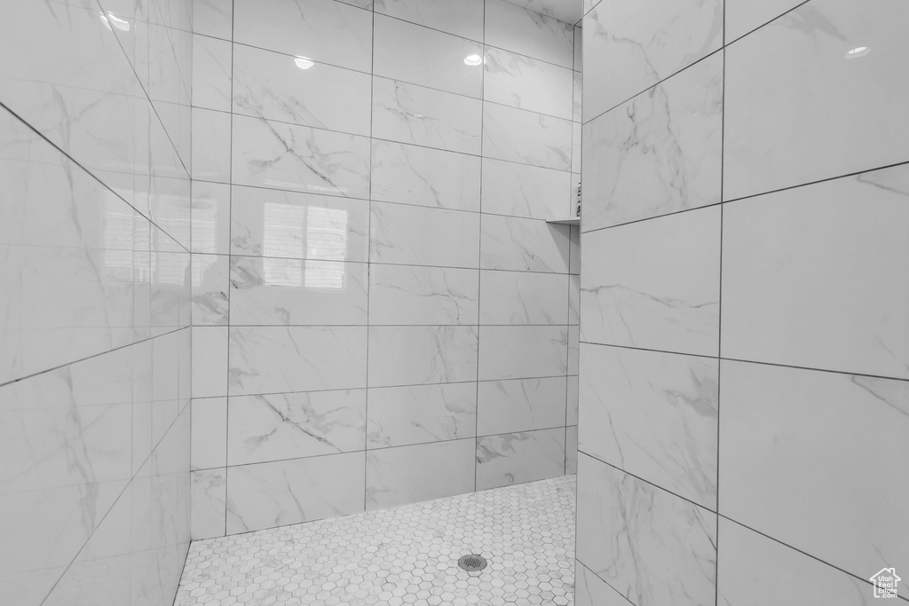 Full bathroom with tiled shower