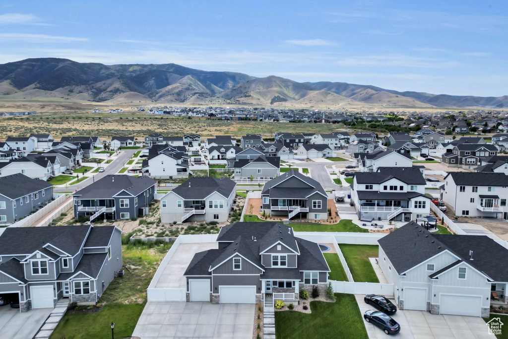 Aerial perspective of suburban area with a mountain backdrop