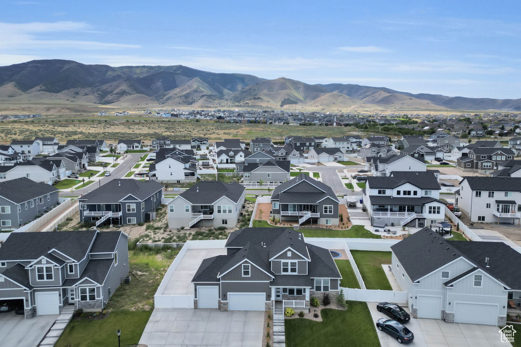 Aerial perspective of suburban area featuring a mountainous background
