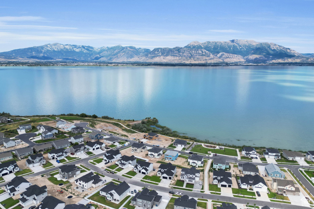 Aerial view of residential area featuring a water and mountain view