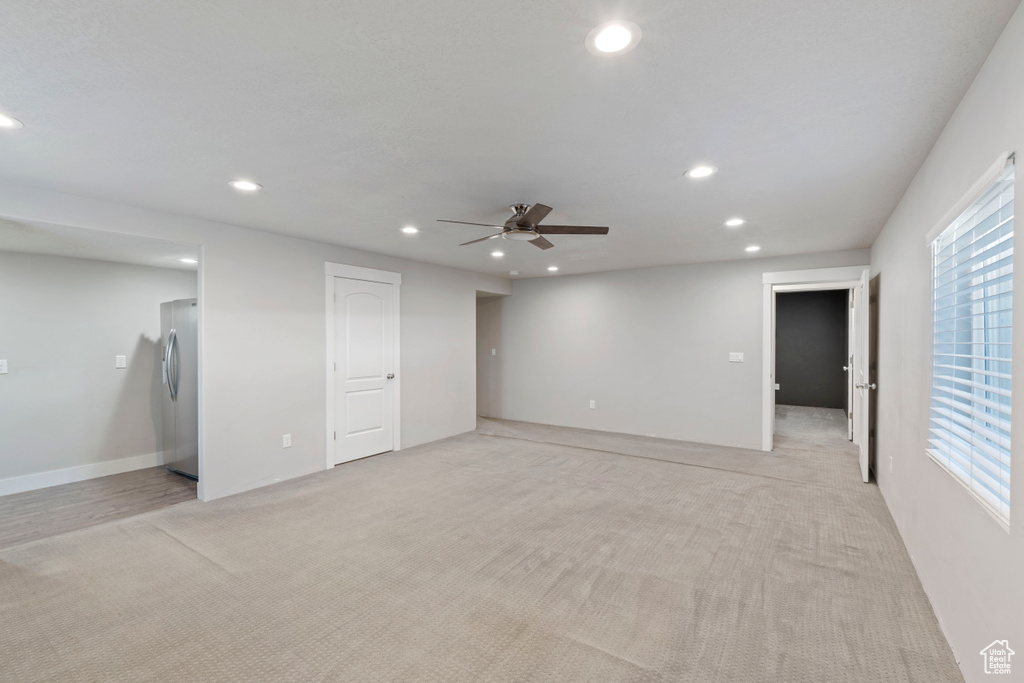 Empty room with recessed lighting, ceiling fan, and light colored carpet