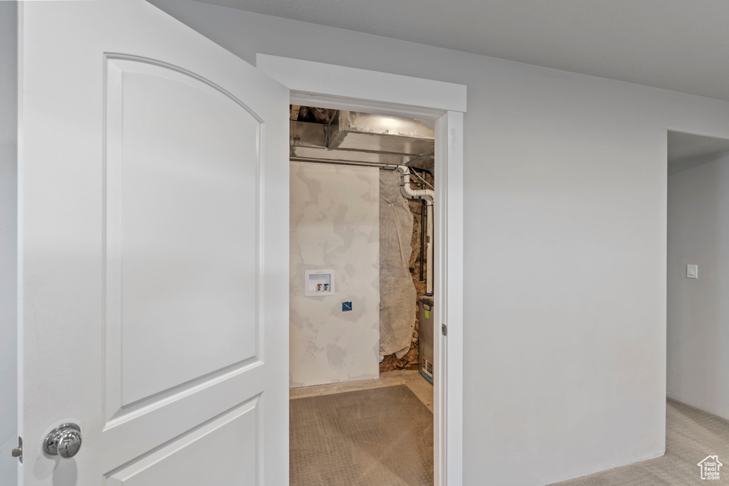 Laundry room featuring light carpet and hookup for a washing machine