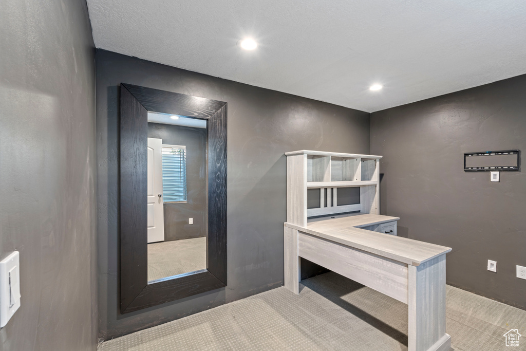 Interior space featuring carpet flooring and recessed lighting