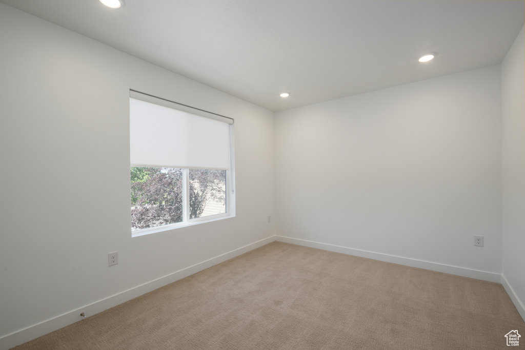 Unfurnished room featuring recessed lighting and light colored carpet