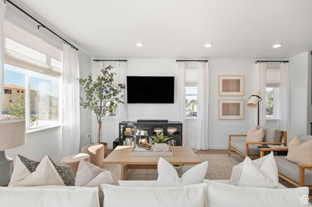 Living room featuring a fireplace and recessed lighting