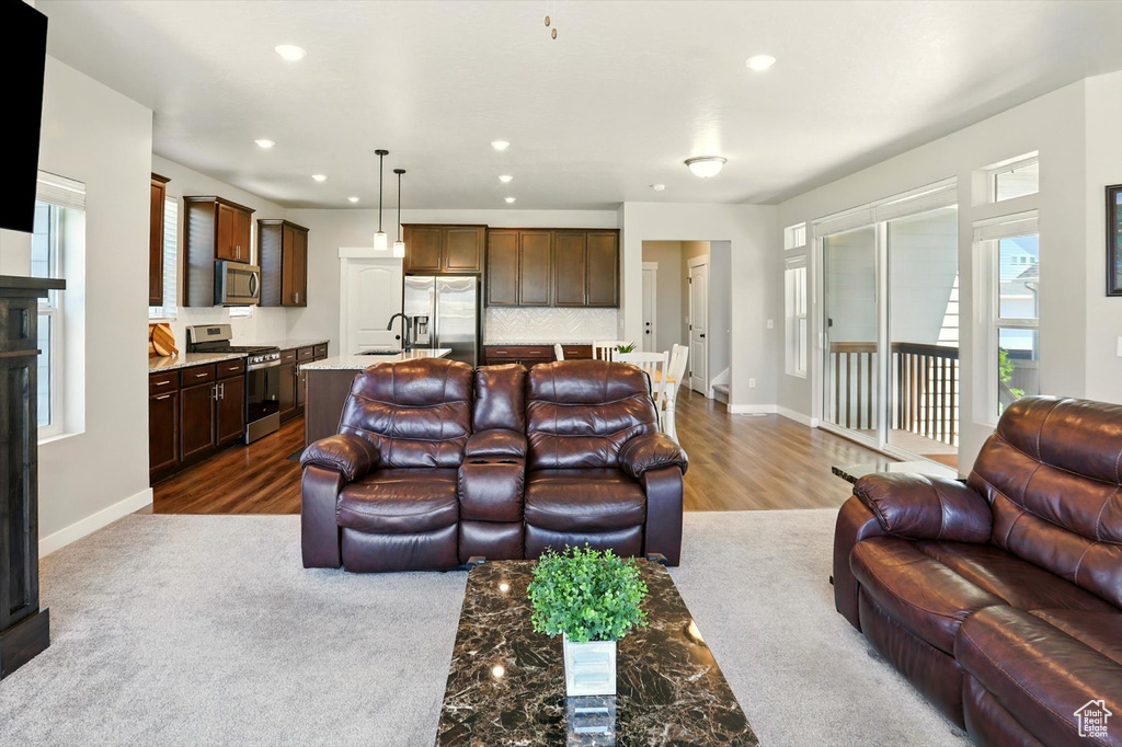 Living room featuring recessed lighting and dark wood finished floors