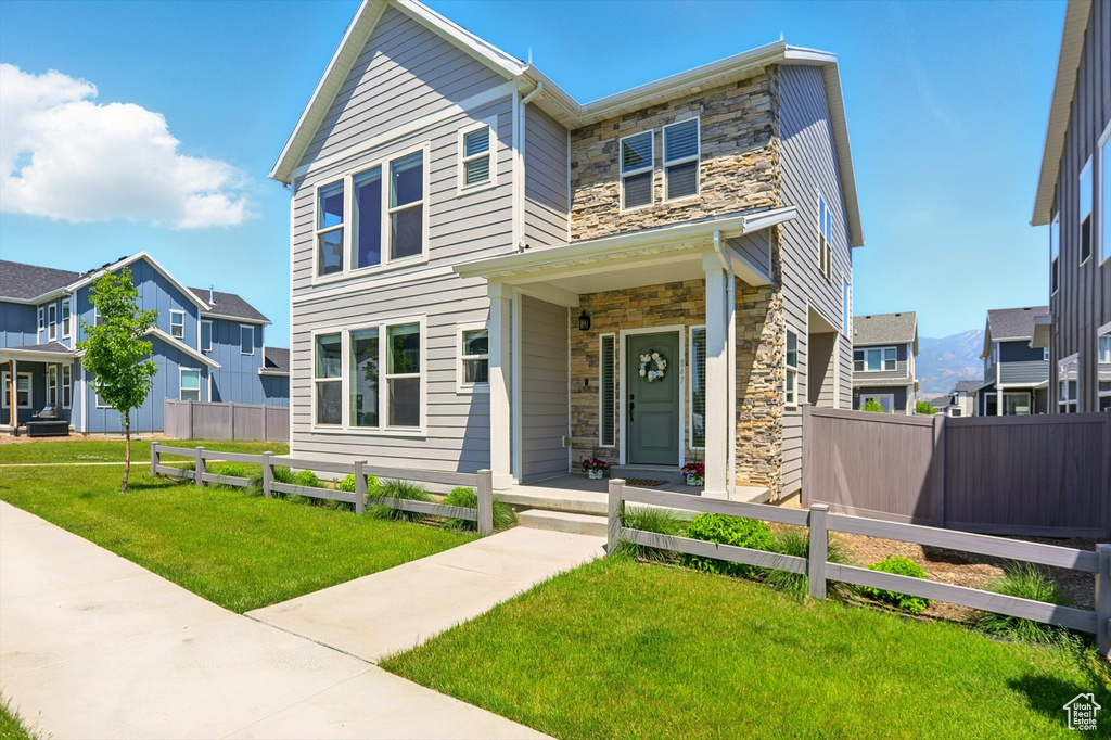 View of front of house with stone siding and a residential view