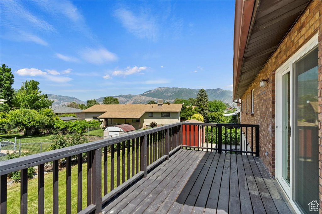 Wooden terrace featuring a mountain view