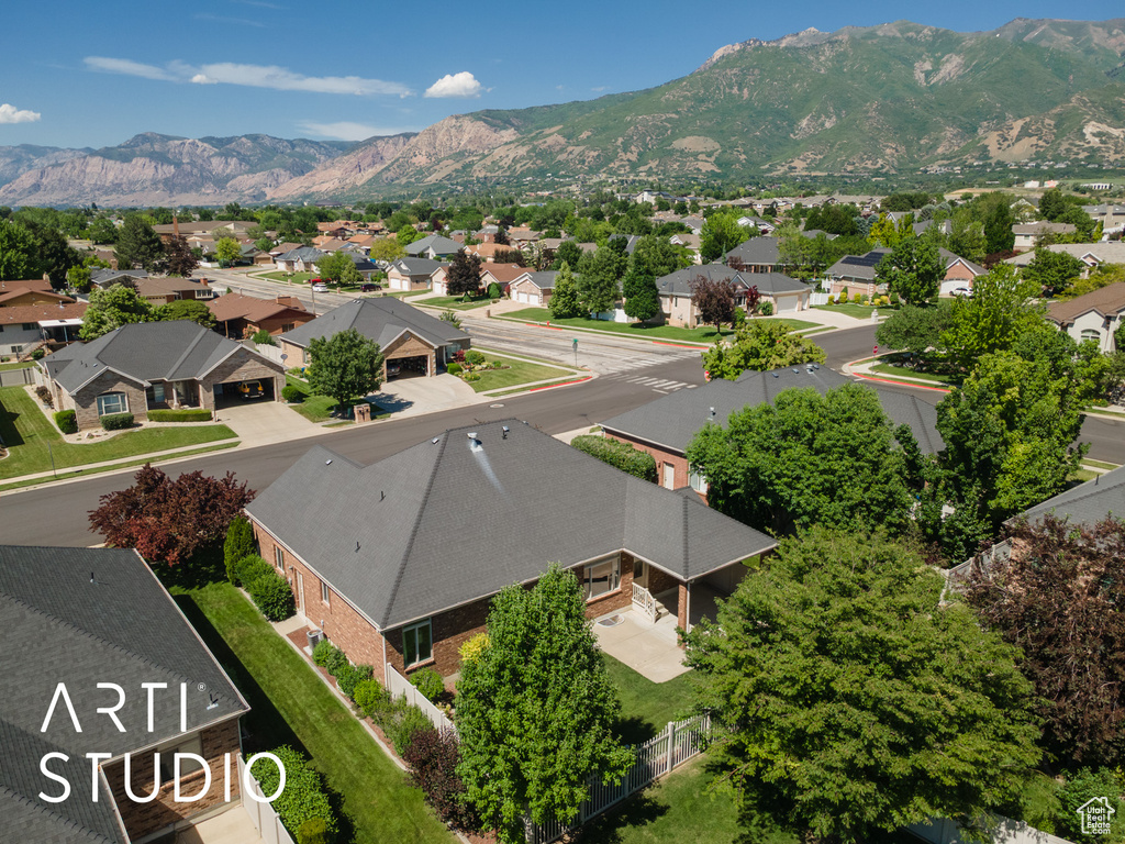 Aerial view of residential area featuring mountains